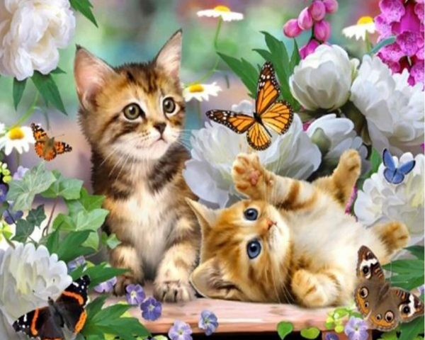 Two Cute Kittens Playing With Butterflies In The Flowers