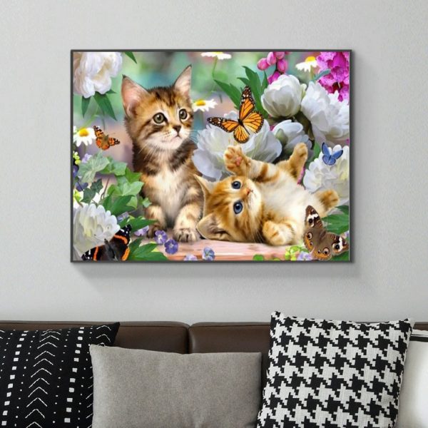 Two Cute Kittens Playing With Butterflies In The Flowers