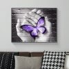 Purple Butterfly On Hand On Gray Wall